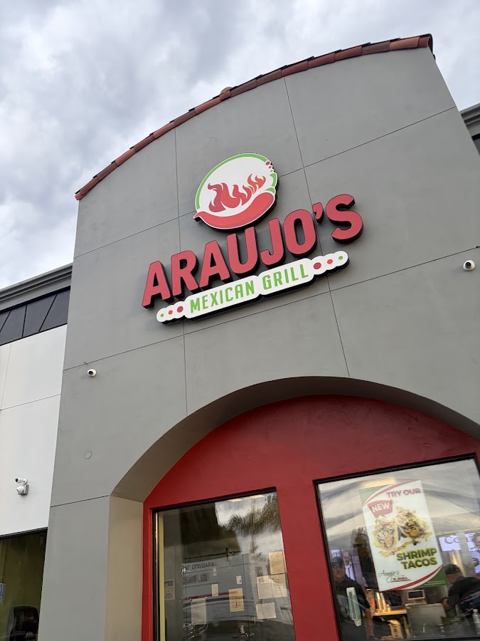 Araujo's Mexican Grill storefront in San Jose, with its illuminated red and green sign